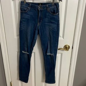 Size 28 super comfortable and stretchy dark denim jeggings with rips at knees